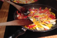 Gently frying the peppers
